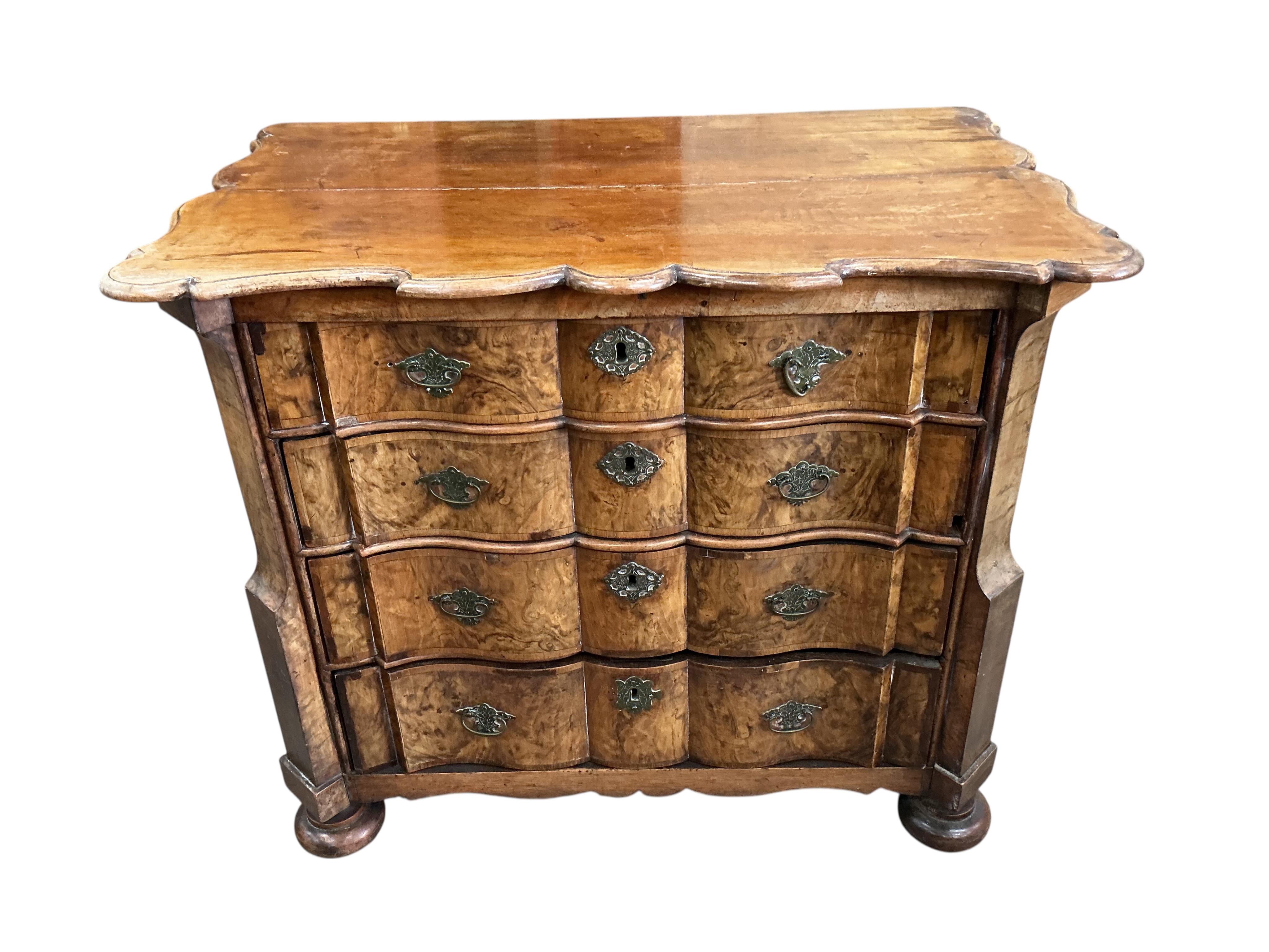 An 18th century Dutch walnut and oak serpentine chest, width 92cm, depth 57cm, height 78cm